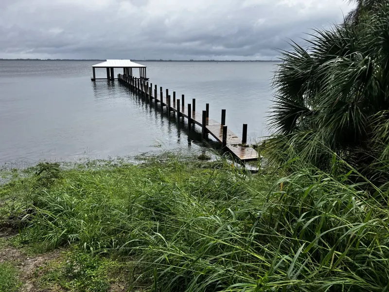 Long fixed pier reaching a covered platform